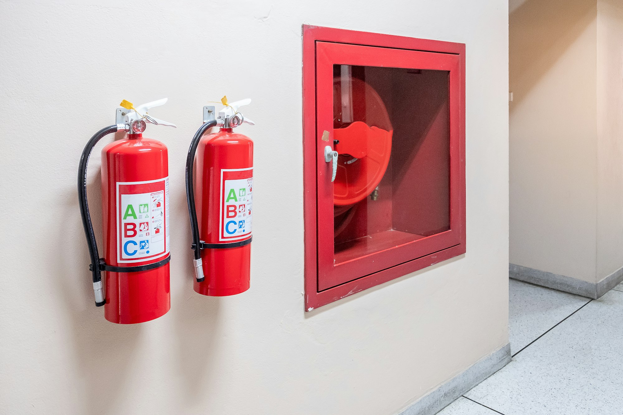 Fire extinguisher system on the wall background,